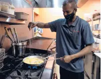  ?? KASSIJACKS­ON/HARTFORD COURANT ?? Jai Kumar cooks at Dosa Hut, a new South Indian vegetarian and vegan restaurant in Rocky Hill.