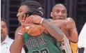  ?? MARK J. TERRILL/AP ?? Lakers forward Kobe Bryant, right, fouls Celtics forward Jae Crowder on April 3, 2016, in Los Angeles.