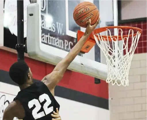  ?? Andrew Stein/Post-Gazette ?? Quaker Valley’s Ryan Stowers goes in for 2 of his 33 points against New Castle Friday night at New Castle High School. The 6-foot-5 senior guard, who averages 22 points a game, was particular­ly effective in transition.