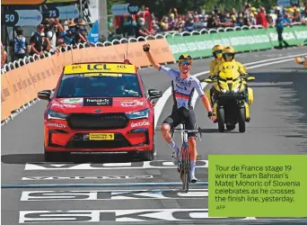  ?? AFP ?? Tour de France stage 19 winner Team Bahrain’s Matej Mohoric of Slovenia celebrates as he crosses the finish line, yesterday.