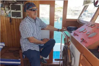  ??  ?? ‘ The boat and the sea are my life,’ says Captain Prasinos after 51 years on the waves.