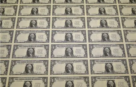  ?? Getty Images file photo ?? These new dollar bills eventually will have serial numbers — and that’s when “star note” and other currency collectors get interested.