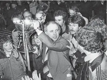  ??  ?? United manager Jim McLean and players are cheered by fans after the League Cup final replay on December 12 1979. After the first game at Hampden ended 0-0, United went on to beat Aberdeen 3-0 at Dens Park.