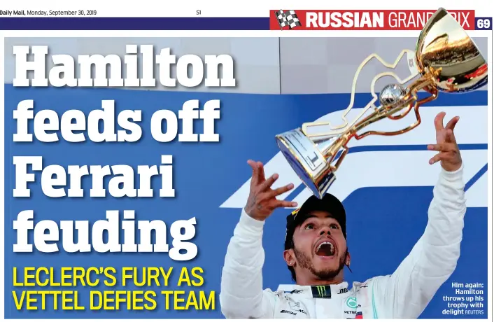  ?? REUTERS ?? Him again: Hamilton throws up his trophy with delight
