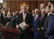  ?? PABLO MARTINEZ MONSIVAIS—ASSOCIATED PRESS ?? House Minority Leader Kevin McCarthy of Calif., center, is joined by fellow Republican lawmakers as he walks up to the podium to begin speaking during a news conference on Capitol Hill in Washington, Thursday, Oct. 31, 2019. Democrats pushed a package of ground rules for their inquiry of President Donald Trump through a sharply divided House, the chamber’s first formal vote in a fight that could stretch into 2020electi­on.