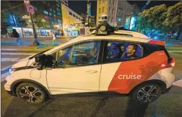  ?? Tayfun Coskun Anadolu Agency ?? A CRUISE robotaxi ferries customers in San Francisco in July. A federal agency says it has received two reports of pedestrian injuries involving Cruise vehicles.