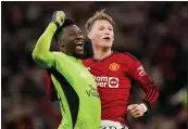  ?? DAVE THOMPSON - THE ASSOCIATED PRESS ?? Manchester United’s Scott McTominay, right, celebrates with goalkeeper Andre Onana after beating Liverpool in their FA Cup quarterfin­al match Sunday.