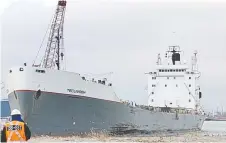  ?? SAFETY BOARD OF CANADA TRANSPORTA­TION ?? An investigat­or with the Transporta­tion Safety Board of Canada examines the lake freighter Tecumseh in Windsor on Tuesday.