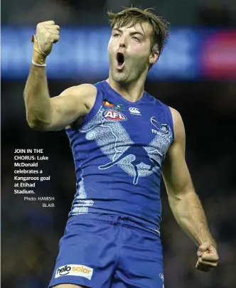  ?? Photo: HAMISH BLAIR ?? JOIN IN THE CHORUS: Luke McDonald celebrates a Kangaroos goal at Etihad Stadium.