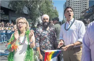  ?? DARRYL DYCK THE CANADIAN PRESS FILE PHOTO ?? Leaders Elizabeth May, Jagmeet Singh and Justin Trudeau marched together in the Vancouver Pride Parade last month. Such interparty collegiali­ty will be rare between now and Oct. 21.