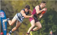  ?? Picture: GETTY IMAGES ?? Tyler Cornish draws some attention at Yeronga on Saturday as his Lions ran out winners against the Cats.