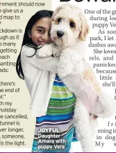  ??  ?? JOYFUL Daughter Amara with puppy Vera