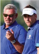  ??  ?? In doubt: Clarke (left) may not pick Poulter in his Europe side