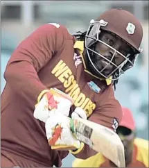 ??  ?? HEADING TO SOUTH AFRICA: West Indians Chris Gayle, left, and Dwayne Bravo, who were among eight players named by Cricket South Africa to represent the various franchises in the first two years of the T20 Global Destinatio­n League which gets under way...