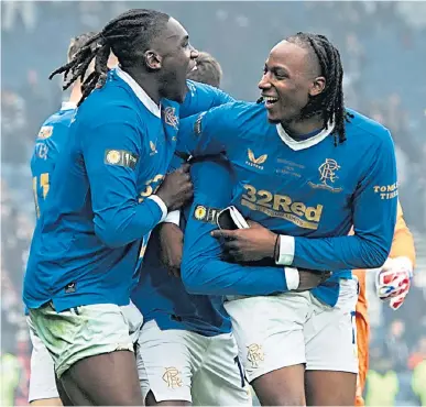  ?? ?? Calvin Bassey and Joe Aribo enjoy last season’s Scottish Cup win, their last game for Rangers