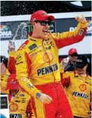  ?? Associated Press ?? n Joey Logano celebrates in Victory Lane after winning the NASCAR Clash auto race Feb. 19 at Daytona Internatio­nal Speedway in Daytona Beach, Fla. Logano won the pole for Sunday’s race.