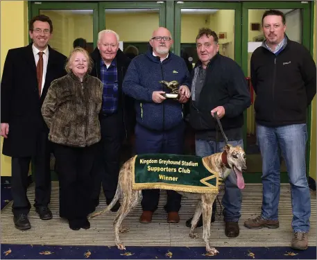  ??  ?? Murt Murphy, KGSSC chairman, presents the winner’s trophy to winning trainer/owner John Sugrue from Cahersivee­n after Fermoyle Trump won the K.G.S.S.C. Stake Final for A4 greyhounds at the Kingdom Greyhound Stadium on Friday night. Included, from left,...