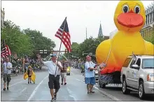  ?? DIGITAL FIRST MEDIA FILE PHOTO ?? Members of the Rotary of Pottstown walk along with their big rubber duck every July 4th parade to let people know about the annual duck race.