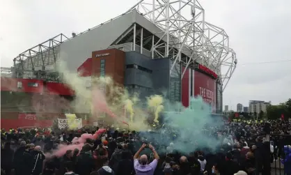  ?? Photograph: Jon Super/AP ?? Manchester United fans protesting against the club’s owners in May last year before the game against Liverpool which was postponed.