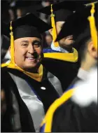  ??  ?? Woonsocket Police Captain Todd Boisvert, head of the traffic, uniform and animal control divisions, center, listens to Sunday’s commenceme­nt address given by William Shatner during New England Institute of Technology’s graduation ceremonies. Boisvert...