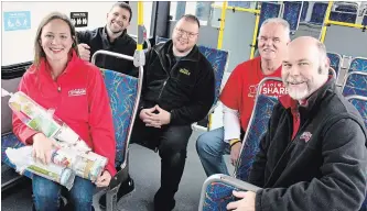  ?? ALISON LANGLEY THE NIAGARA FALLS REVIEW ?? Four stores teamed up over the weekend to see which could collect the most donations for Project SHARE’s Christmas program. Pictured above are Pam Sharp of Project SHARE, Chris Russell of Niagara Transit, and southend competitor­s Craig Parry from Canadian Tire and Joel Ferri and Jason Reid from Food Basics.