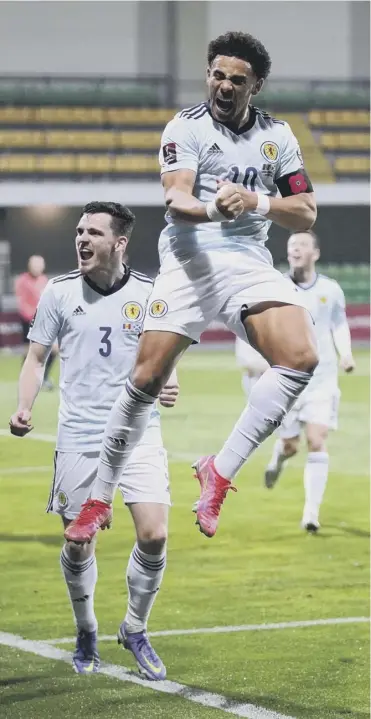  ?? ?? Che Adams jumps for joy after putting Scotland 2-0 up against Moldova last night