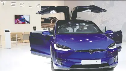  ?? FRANCOIS LENOIR/REUTERS FILES ?? Evidence that Tesla can sell cars for more than it costs to produce them has transforme­d the mood — and with it Tesla’s stock price, says Chris Bryant. But Bryant points out that there are underwhelm­ing facts about the firm to consider. Above, a Tesla Model X car.