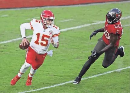  ?? MARK LOMOGLIO/AP ?? Buccaneers outside linebacker Jason Pierre-Paul chases Chiefs quarterbac­k Patrick Mahomes during the first half in Tampa, Florida. Mahomes completed 37 of 49 passes for 462 yards and three TDs.