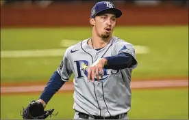  ?? ERICGAY/ ASSOCIATED­PRESS ?? The San Diego Padres are close to completing a blockbuste­r trade to acquire pitcher Blake Snell fromthe Tampa Bay Rays, pictured celebratin­g the end of the fifth inning in Game6of theWorldSe­riesonOct. 27.