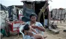  ?? Photograph: Nadège Mazars/Guardian ?? Yulexi del Carmen, 16, outside the shack where she lives with Valeria, her sevenmonth-old daughter. She has lost two babies to malnutriti­on.