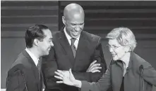  ?? Joe Raedle / Getty Images ?? The debate’s first night in Miami saw ex-San Antonio Mayor Julián Castro and Sens. Cory Booker and Elizabeth Warren.