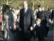 ?? JOE GIDDENS/PA VIA AP ?? From left, Kate, Duchess of Cambridge, Britain’s Prince William and their children Prince George, right, and Princess Charlotte arrive to attend the Christmas Day morning church service at St. Mary Magdalene Church in Sandringha­m, Norfolk, England, Wednesday, Dec. 25.