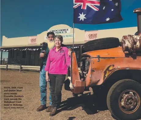  ?? TOTAL BAN: Frank and Debbie Wust stand beside Crocodile Dundee’s truck outside the Walkabout Creek Hotel in McKinlay. Picture: EVAN MORGAN ??