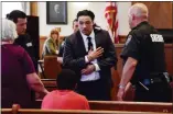  ?? TANIA BARRICKLO — DAILY FREEMAN ?? Maurice Stansberry Sr., center, in handcuffs, motions an embrace to someone in the Ulster County Court gallery after he was convicted of second-degree murder on Friday.