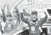  ?? MATT SULLIVAN/GETTY IMAGES ?? Dale Earnhardt Jr. celebrates in Victory Lane after winning the GEICO 500 at Talladega Superspeed­way.