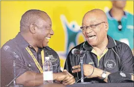  ??  ?? CONGRATULA­TORY HANDSHAKE: ANC president Jacob Zuma, right, celebrates with the party’s new deputy president, Cyril Ramaphosa, at the 2012 elective conference