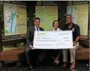  ?? DIGITAL FIRST MEDIA FILE PHOTO ?? In this file photo, Montgomery County Commission­ers Joe Gale; Val Arkoosh, M.D., Chair; and Ken Lawrence, Jr., Vice Chair, accept a check from the Pennsylvan­ia Environmen­tal Council to begin a fund for trail trail head signage maintenanc­e along the...