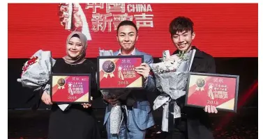  ??  ?? Sing! China 2018 Malaysia winners (from left) first runner-up Adlyn Maasyah, champion Ooi and second runner-up Chee. They will represent Malaysia in the third season of Sing! China .— SHAARI CHEMAT/ The Star