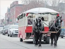  ?? METROLAND CAMBRIDGE TIMES FILE PHOTO ?? A horse-drawn trolley operated by St. Jacobs Horse Drawn Tours was one of the main attraction­s at the annual Candyland event in Cambridge in 2015.