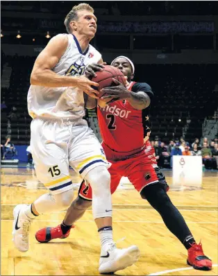  ?? KEITH GOSSE/THE TELEGRAM ?? Braylon Rayson (2) of the Windsor Express tries to wrest the ball away from St. John’s Edge guard Tyler Haws during National Basketball League of Canada action at Mile One Centre Wednesday night.