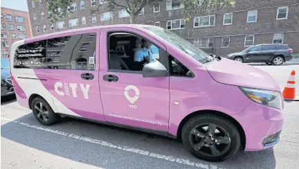  ?? REUTERS ?? A Via ridesharin­g van, which recently began operating in partnershi­p with the city-run bus system, makes a stop in Jersey City, New Jersey on June 23.