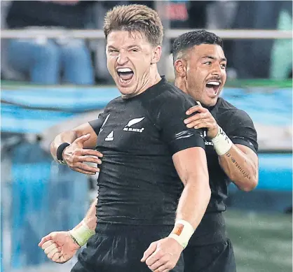  ??  ?? New Zealand’s Beauden Barrett, left, is congratula­ted by Richie Mo’unga after scoring a try against Ireland.