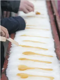  ?? CHRISTALEE FROESE ?? Maple syrup taffy is a nine-generation tradition at cabane à sucre L’EnTailleur on Île d’Orléans.