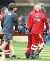  ??  ?? Hammer blow: Clermont fly-half Camille Lopez is carried off after breaking his left leg