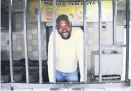  ?? Picture: Michel Bega ?? IN TROUBLE. Sizwe Khoza stands inside his shop, Mapule YFM Kota’s, in Soweto.