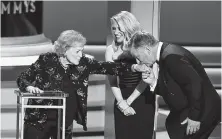  ?? Getty Images ?? Betty White, left, was honored by Kate McKinnon and Alec Baldwin during a segment marking her distinguis­hed career.