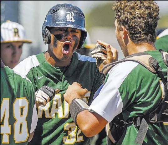  ?? Patrick Connolly Las Vegas Review-Journal @PConnPie ?? LEFT: Rancho High School shortstop Edarian Williams is pumped after scoring a thirdinnin­g run in a 5-1 home victory Saturday against Coronado and shares the enthusiasm with his teammates.