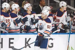  ??  ?? Edmonton Oilers forward Mark Letestu (55) celebrates a goal against the Calgary Flames during third period NHL preseason action in Edmonton, Alta., on Monday