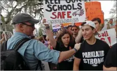  ?? AP PHOTO/GERALD HERBERT ?? In this Wednesday file photo, student survivors from Marjory Stoneman Douglas High School are greeted as they arrive at a rally for gun control reform on the steps of the state capitol, in Tallahasse­e, Fla.