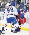  ?? AP PHOTO ?? Montreal Canadiens’ Brandon Davidson (88) checks New York Rangers’ Michael Grabner (40) during the second period of an NHL hockey game in Game 4 of an NHL hockey first-round playoff series on Tuesday.